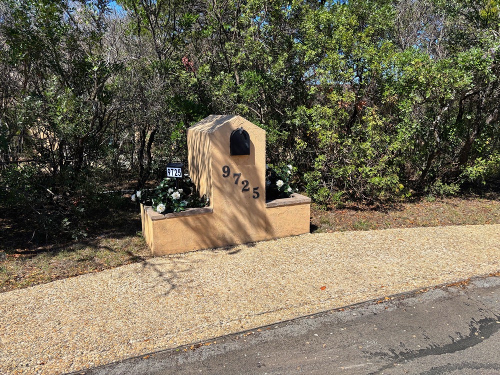 The 9725 mailbox at the end of the driveway